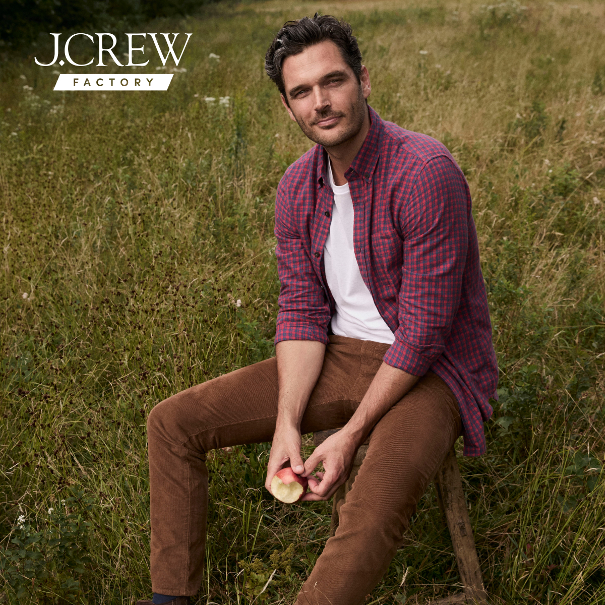 j crew picking a christmas tree loading it on back of pick up truck happy family