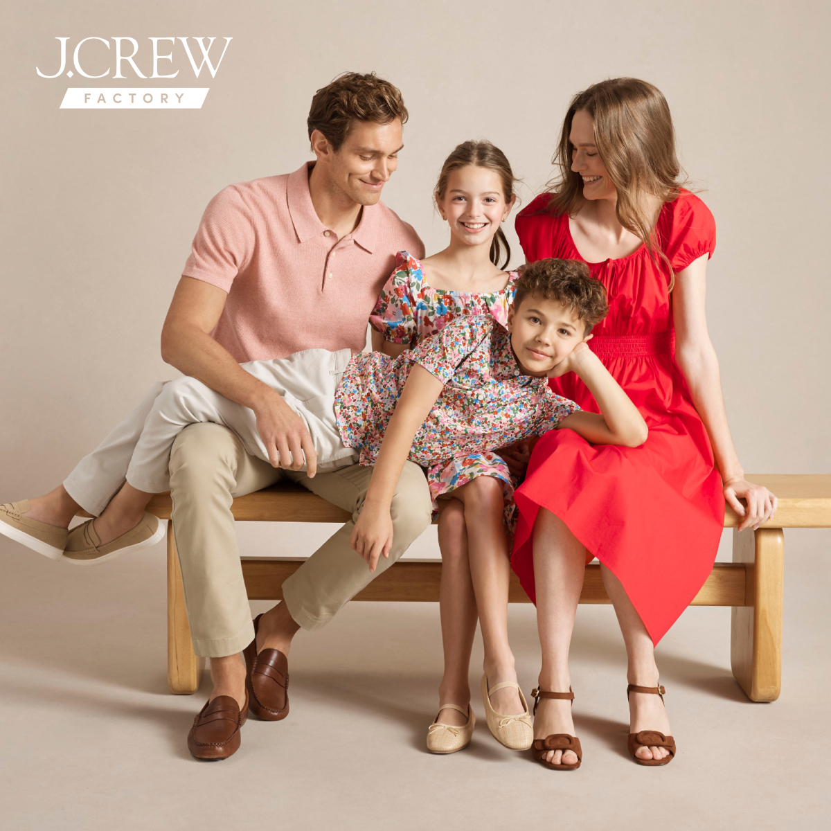 j crew picking a christmas tree loading it on back of pick up truck happy family