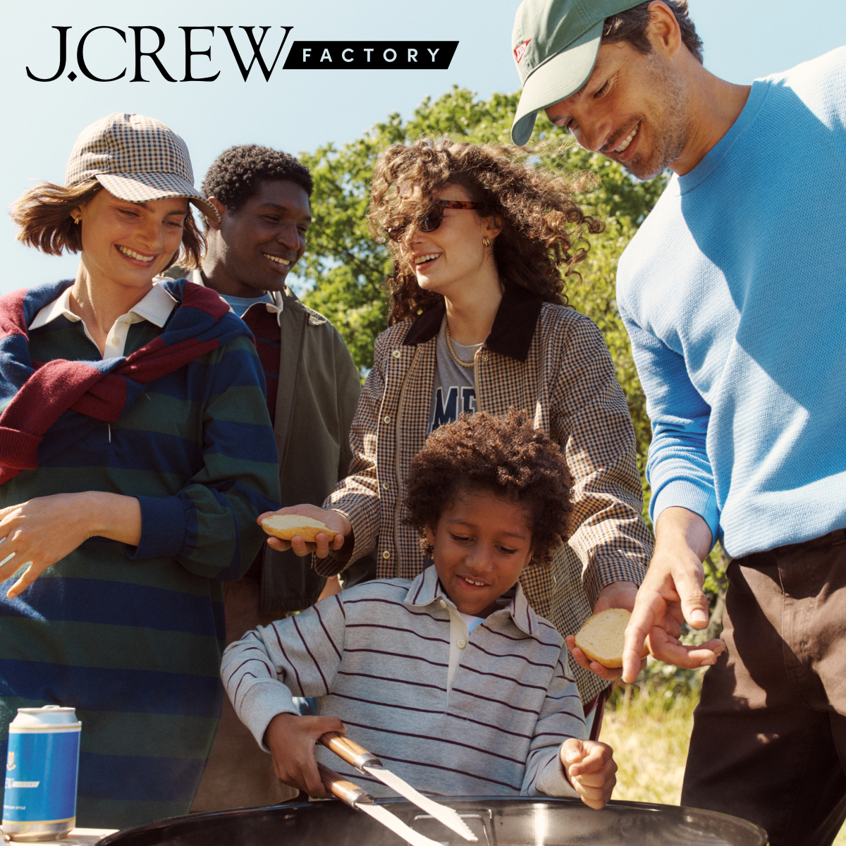 j crew picking a christmas tree loading it on back of pick up truck happy family